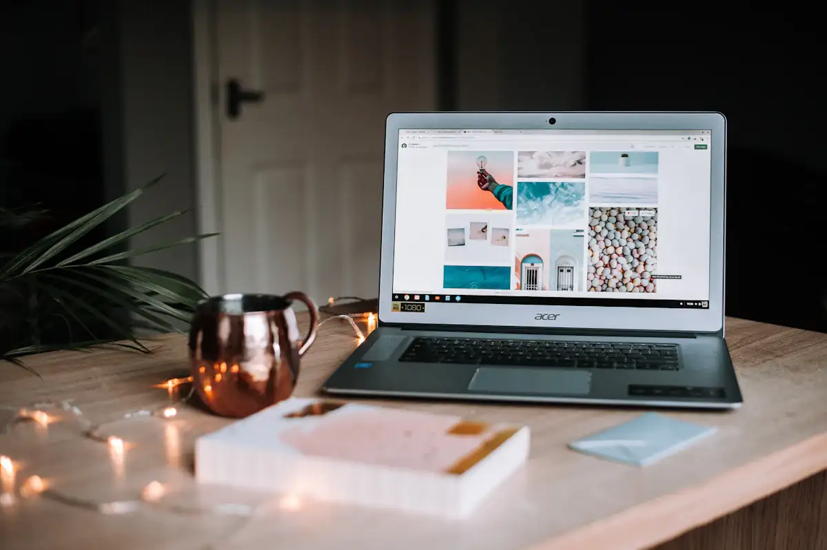 Warm desk with a laptop and a mug where the shortlist is written