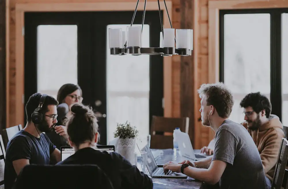 Small team working together at a shared table
